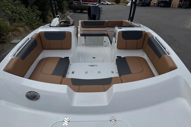 Slide: The Image of 2026 Tahoe 2150 boat interior with tan and black seating, spacious layout. - 7