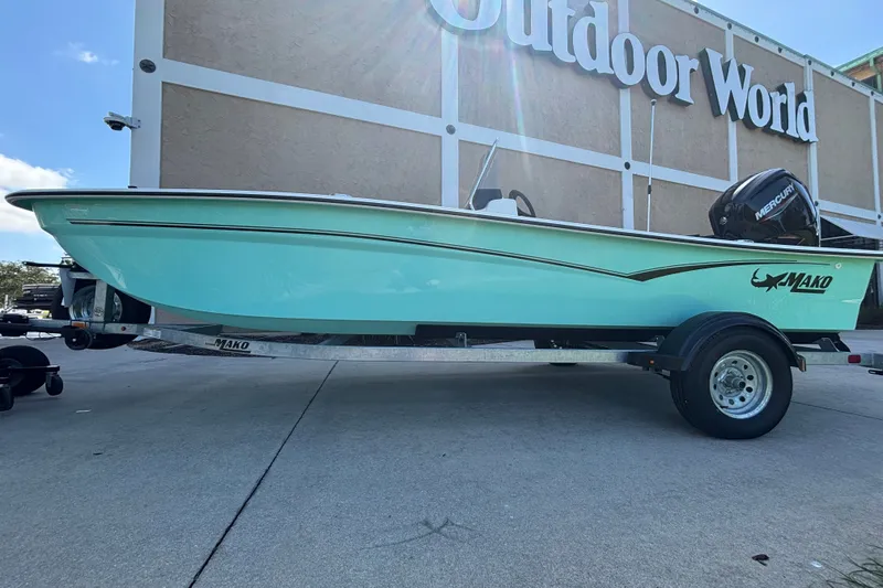 Slide: The Image of 2026 Mako Pro Skiff 17 CC boat on trailer outside Outdoor World. - 47