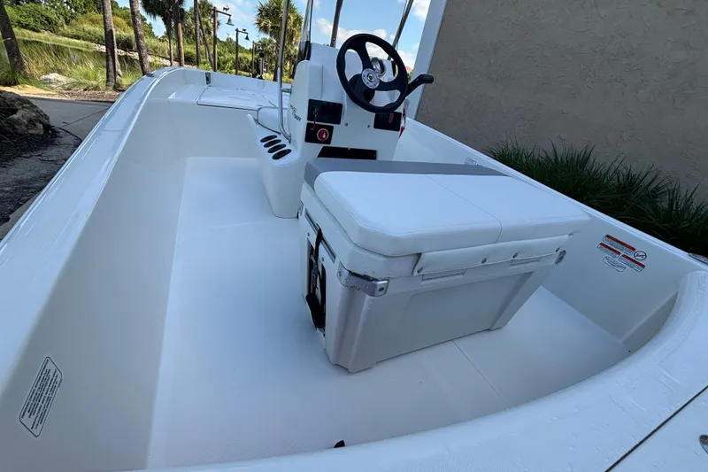 Slide: The Image of 2026 Mako Pro Skiff 17 CC boat interior with steering console and seating. - 50