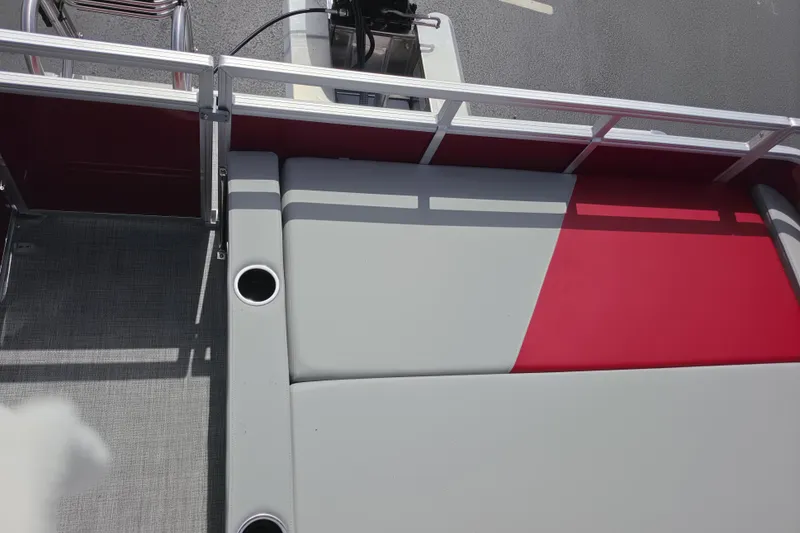 Slide: The Image of 2026 Sun Tracker Party Barge 22 RF DLX pontoon boat seating with cup holders. - 13