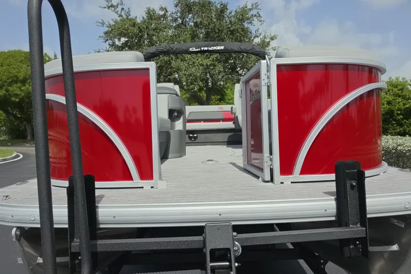 Slide: The Image of 2026 Sun Tracker Party Barge 22 RF DLX pontoon boat with vibrant red exterior. - 3