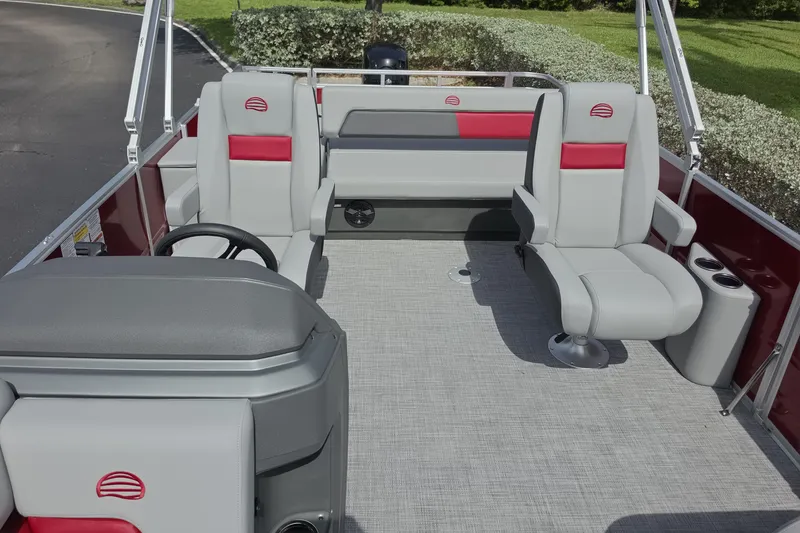 Slide: The Image of 2026 Sun Tracker Party Barge 22 RF DLX interior with gray and red seating. - 6