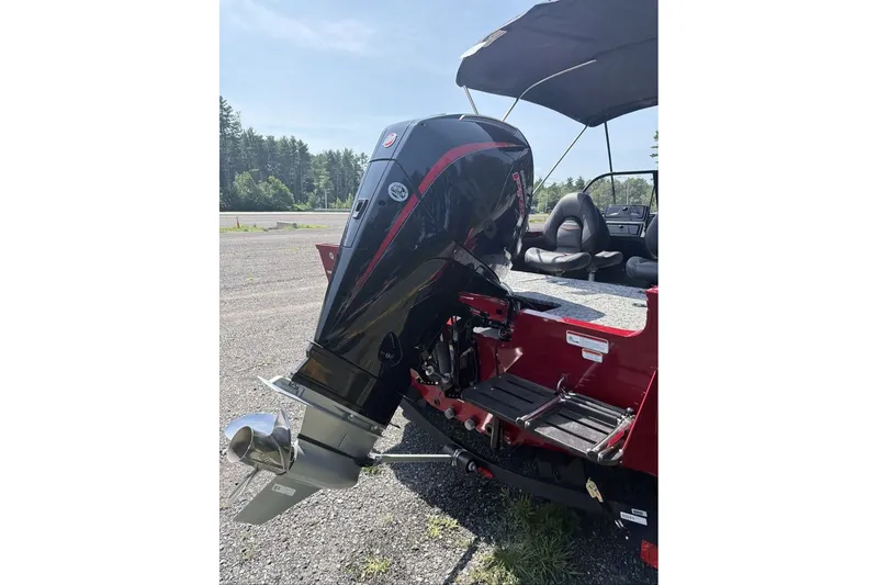 Slide: The Image of 2026 Tracker Targa V-19 WT boat with powerful outboard motor in a sunny outdoor setting. - 9