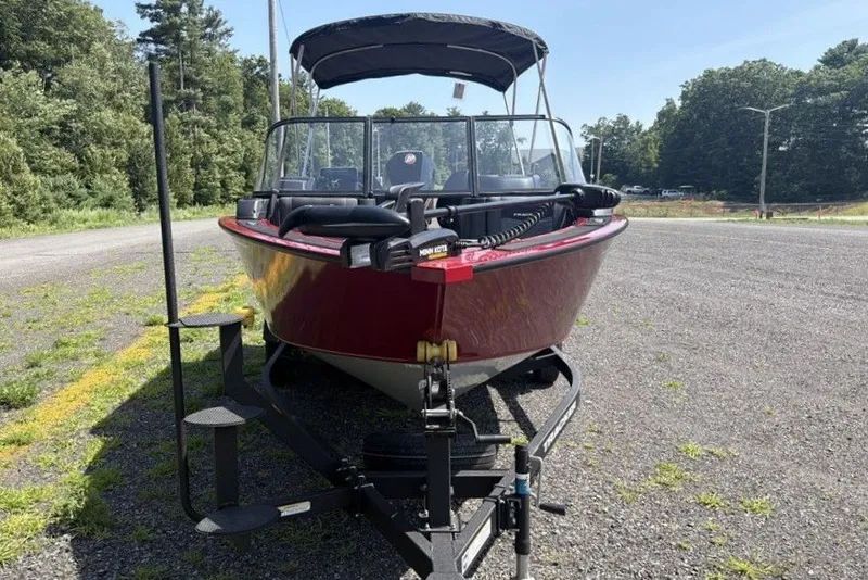 Slide: The Image of 2026 Tracker Targa V-19 WT boat on trailer, parked outdoors on a sunny day. - 6