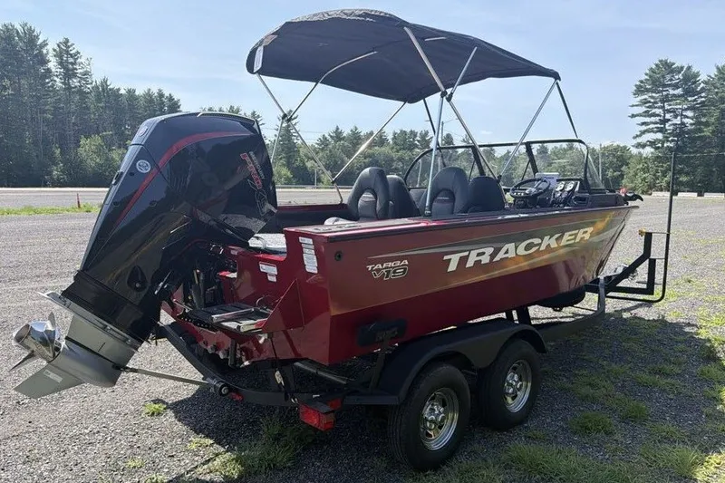 Slide: The Image of 2026 Tracker Targa V-19 WT boat on trailer, parked outdoors with canopy. - 5