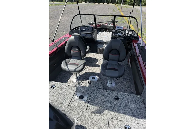 Slide: The Image of 2026 Tracker Targa V-19 WT boat interior with dual seats and dashboard view. - 11