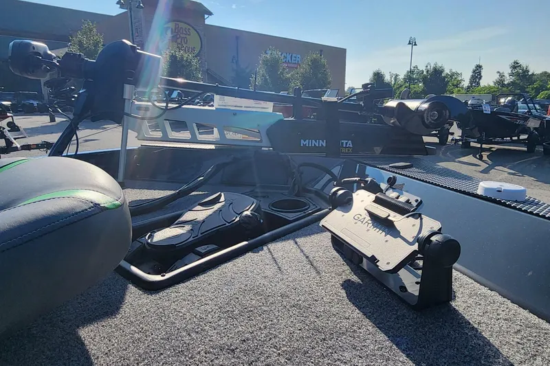 Slide: The Image of 2026 Ranger RT178 boat interior with Garmin and Minn Kota equipment in a parking lot. - 3