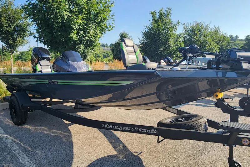 Slide: The Image of 2026 Ranger RT178 boat on trailer, parked outdoors, featuring sleek design and modern equipment. - 1