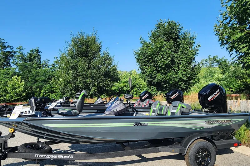 The Image of 2026 Ranger RT178 boat with Mercury engines, parked outdoors on a sunny day. - 0