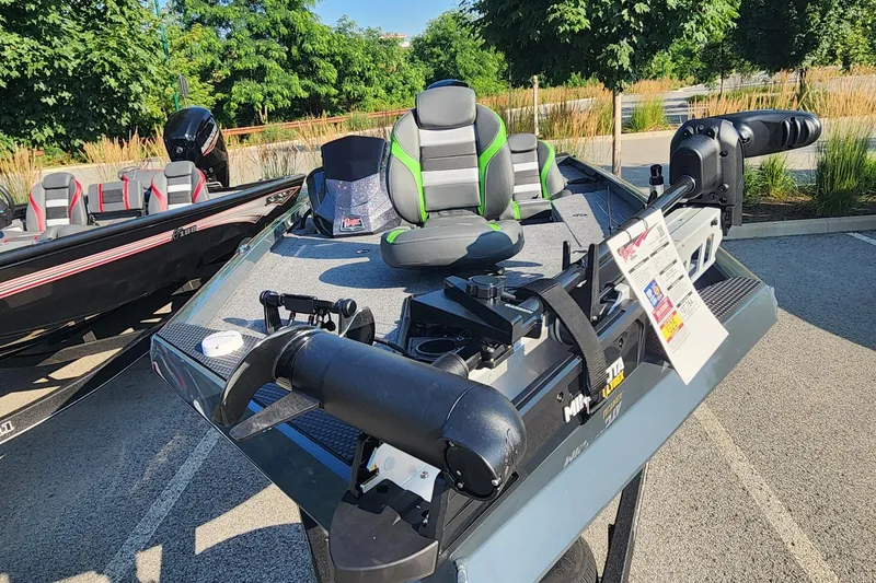 Slide: The Image of 2026 Ranger RT178 fishing boat with modern seating and equipment, displayed outdoors. - 2