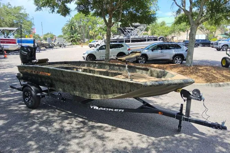 Slide: The Image of 2026 Tracker Grizzly 1756 T Marsh boat on trailer in parking lot. - 5