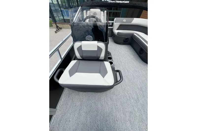 Slide: The Image of 2026 Sun Tracker Bass Buggy 16 XL Select boat interior with gray and white seating. - 4