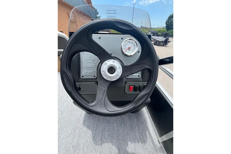 Slide: The Image of Steering wheel and dashboard of 2026 Sun Tracker Bass Buggy 16 XL Select boat. - 5