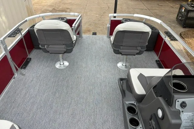Slide: The Image of 2026 Sun Tracker Bass Buggy 18 DLX pontoon boat interior with seating and console. - 18
