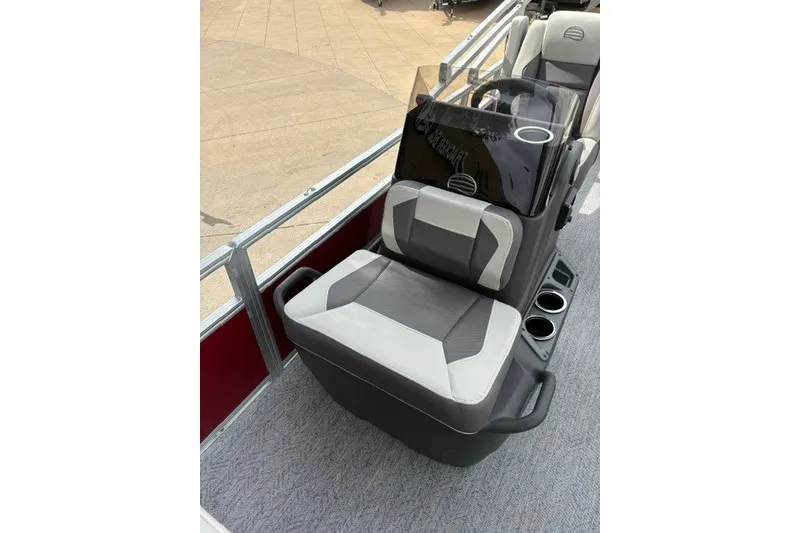 Slide: The Image of 2026 Sun Tracker Bass Buggy 18 DLX boat interior with comfortable seating and cup holders. - 16