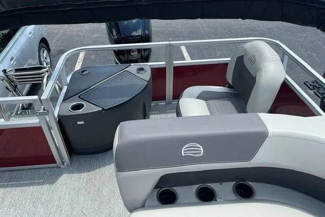 Slide: The Image of 2026 Sun Tracker Bass Buggy 18 DLX pontoon boat interior with seating and storage. - 10