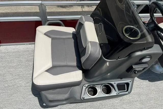 Slide: The Image of 2026 Sun Tracker Bass Buggy 18 DLX boat seat with cup holders and console. - 8