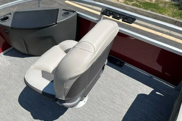 Slide: The Image of 2026 Sun Tracker Bass Buggy 18 DLX boat seat with console and cup holders. - 101