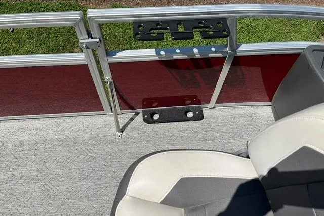 Slide: The Image of 2026 Sun Tracker Bass Buggy 18 DLX boat interior with seating and railing details. - 103