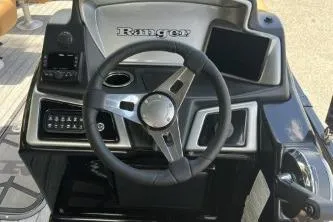 Slide: The Image of Steering console of 2026 Ranger 223FC boat with modern controls and sleek design. - 7