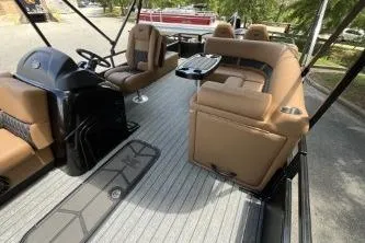 Slide: The Image of 2026 Ranger 223FC boat interior with tan seating and sleek design. - 6