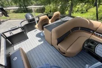 Slide: The Image of 2026 Ranger 223FC boat interior with tan seating and sleek design. - 3