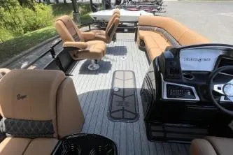 Slide: The Image of 2026 Ranger 223FC boat interior with tan seating and modern dashboard. - 5