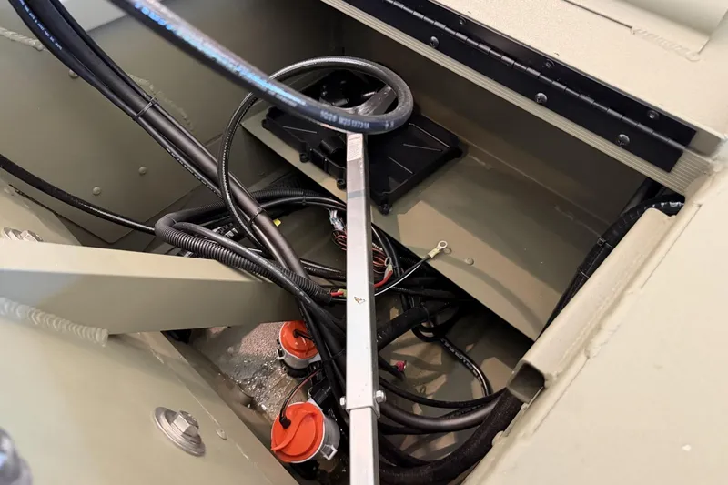 Slide: The Image of Interior view of 2026 Tracker Grizzly 2072 CC boat showing wiring and components. - 4