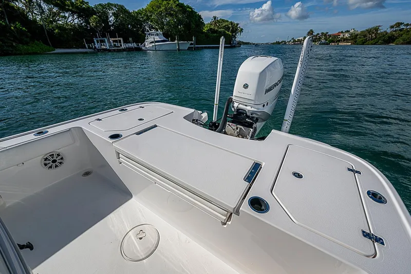 Slide: The Image of 2020 Caymas 28 HB boat deck with Mercury engine on calm water. - 18