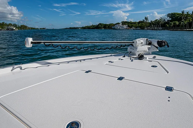 Slide: The Image of 2020 Caymas 28 HB boat deck with trolling motor on a sunny day. - 12