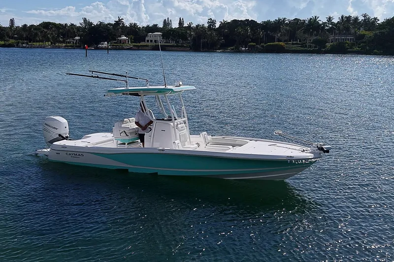 The Image of 2020 Caymas 28 HB boat on calm water, featuring sleek design and modern amenities. - 1