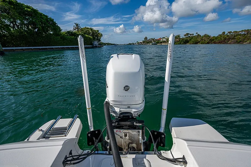 Slide: The Image of 2020 Caymas 28 HB boat with outboard motor on a scenic waterway. - 20