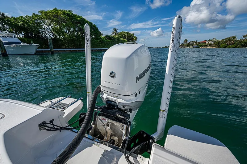 Slide: The Image of 2020 Caymas 28 HB boat with Mercury outboard motor on a sunny day. - 19