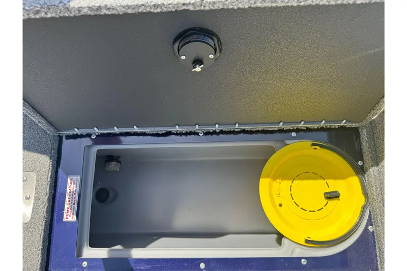 Slide: The Image of 2024 Tracker Targa V-18 Combo livewell with yellow lid and pump-out feature. - 18
