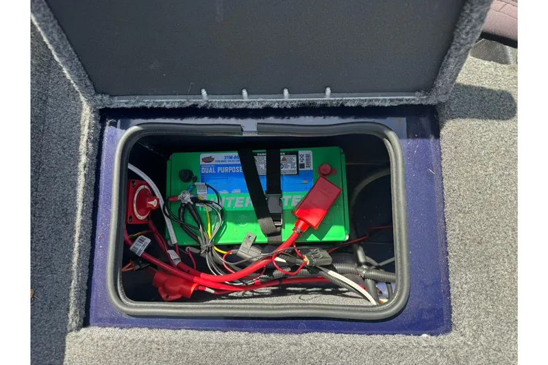 Slide: The Image of Battery compartment of 2024 Tracker Targa V-18 Combo boat, featuring wiring and connections. - 23