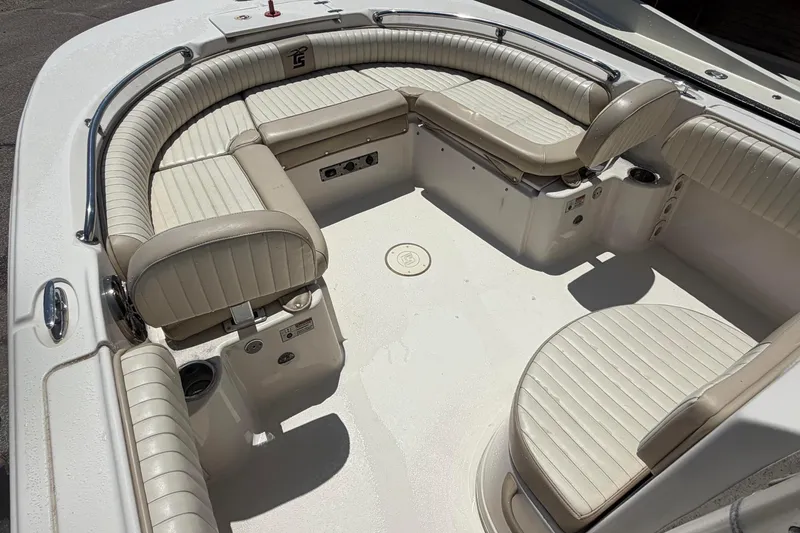 Slide: The Image of 2018 Carolina Skiff 22 Ultra Elite boat interior with beige seating and stainless steel railings. - 23
