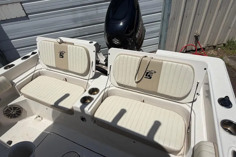 Slide: The Image of 2018 Carolina Skiff 22 Ultra Elite boat seating and motor detail. - 22