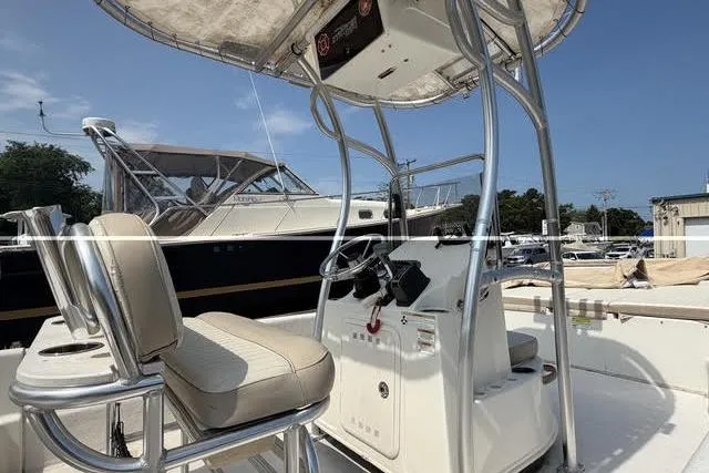Slide: The Image of 2018 Carolina Skiff 22 Ultra Elite boat interior with helm and seating. - 12