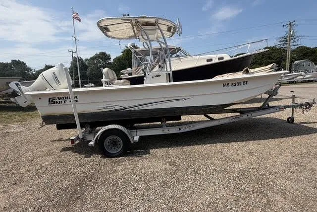 The Image of 2018 Carolina Skiff 22 Ultra Elite boat on trailer, parked outdoors. - 0