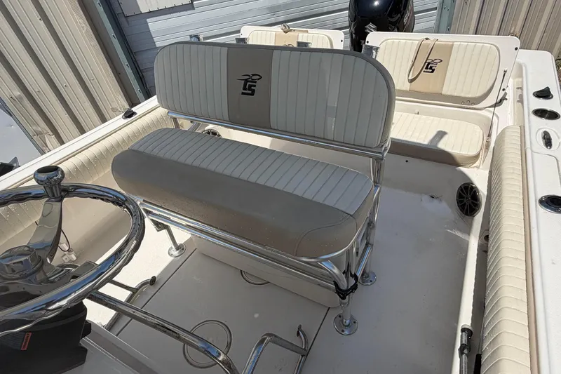 Slide: The Image of 2018 Carolina Skiff 22 Ultra Elite boat interior with seating and steering wheel. - 20