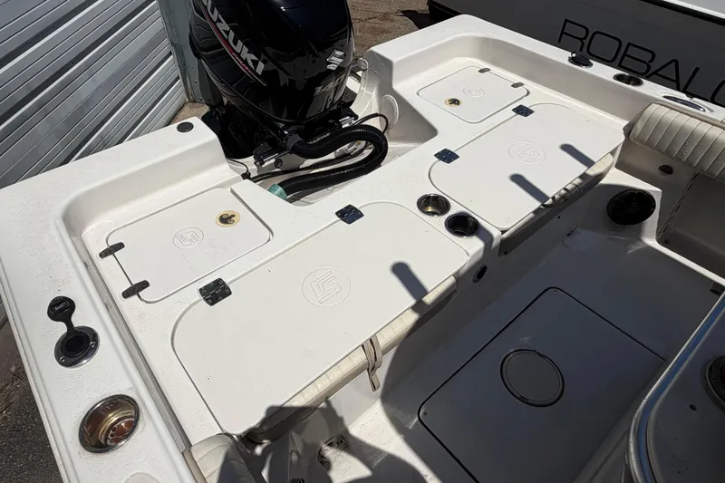 Slide: The Image of 2018 Carolina Skiff 22 Ultra Elite boat deck with Suzuki outboard motor. - 24