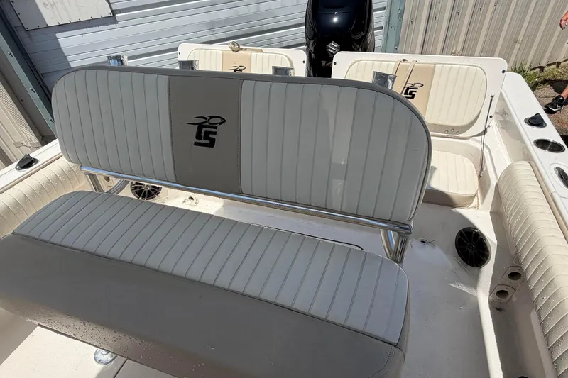 Slide: The Image of 2018 Carolina Skiff 22 Ultra Elite boat interior with seating and storage compartments. - 21