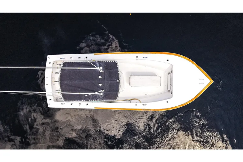 Slide: The Image of Aerial view of 1977 Scarborough 27 CC boat on dark water. - 2