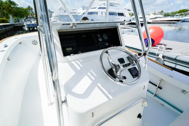 Slide: The Image of 1977 Scarborough 27 CC boat helm with steering wheel and control panel. - 13