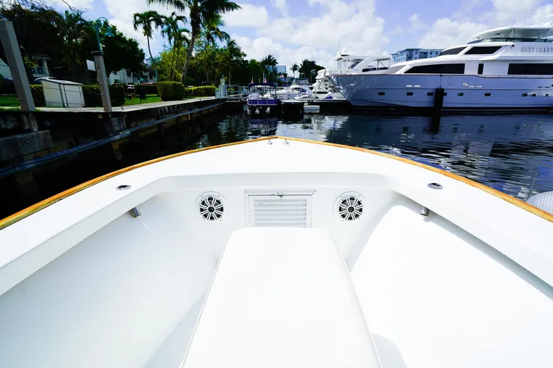 Slide: The Image of Bow view of a 1977 Scarborough 27 CC boat docked in a marina. - 18