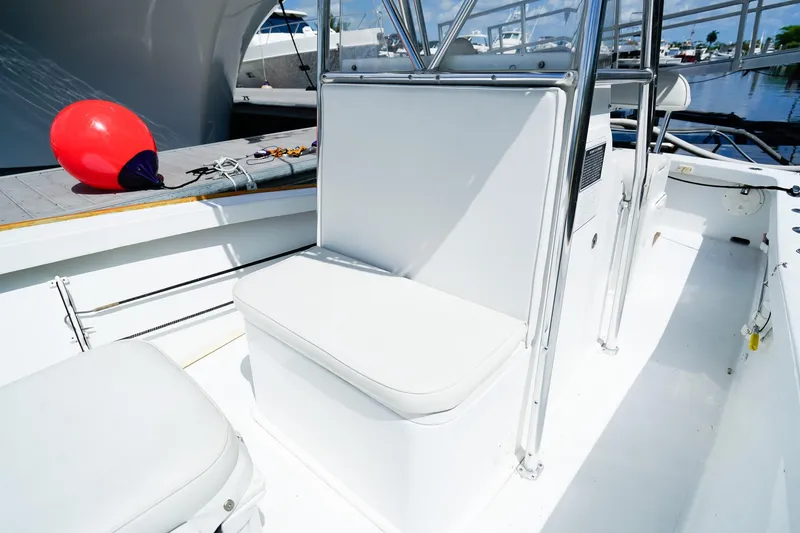 Slide: The Image of 1977 Scarborough 27 CC boat interior with white seating and a red buoy. - 16