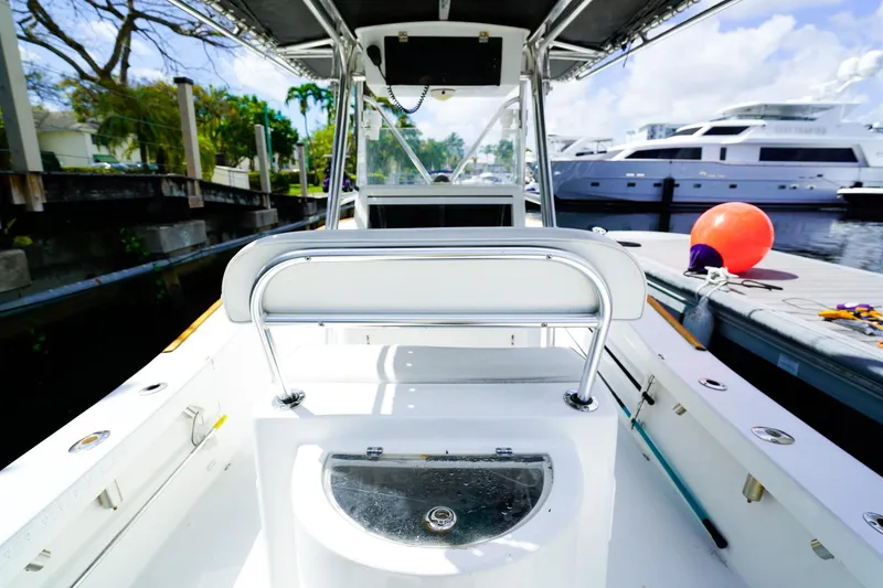 Slide: The Image of 1977 Scarborough 27 CC boat interior with docked yachts in background. - 4