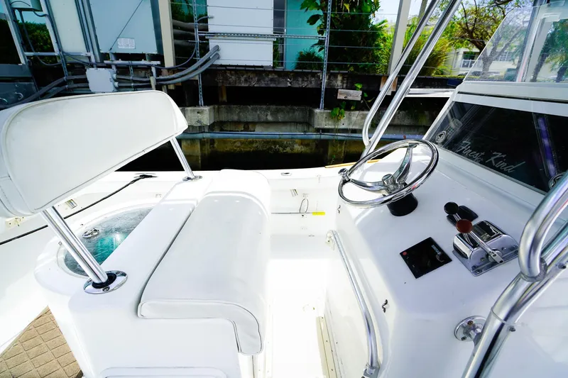 Slide: The Image of 1977 Scarborough 27 CC boat interior with steering wheel and controls. - 9