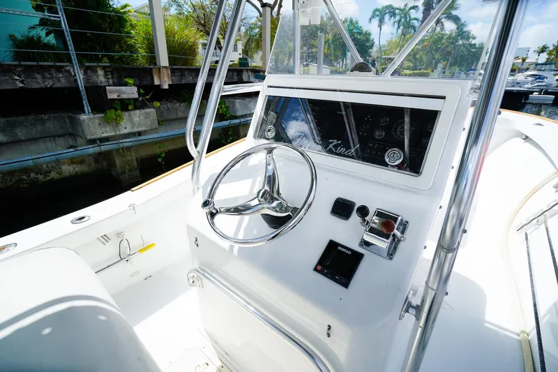 Slide: The Image of 1977 Scarborough 27 CC boat helm with steering wheel and control panel. - 10
