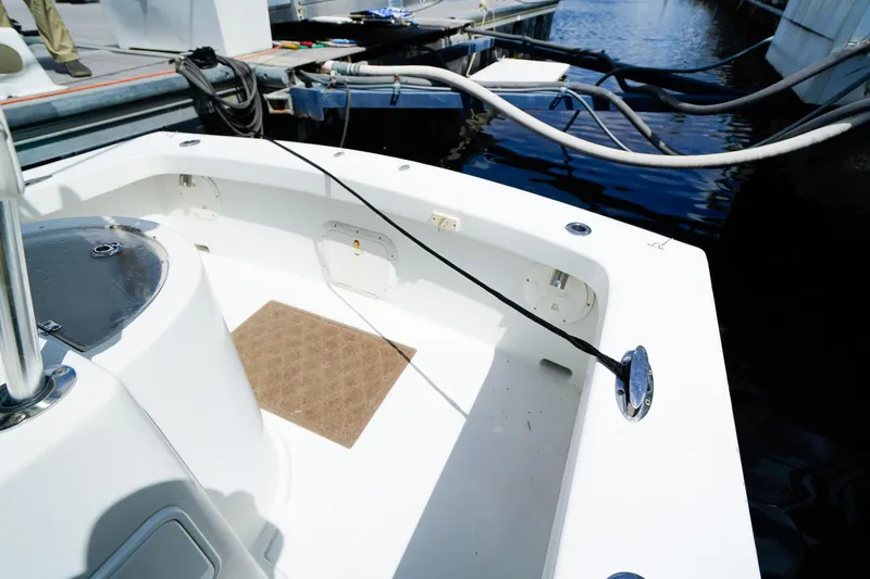 Slide: The Image of 1977 Scarborough 27 CC boat interior at dock, featuring clean white deck. - 5